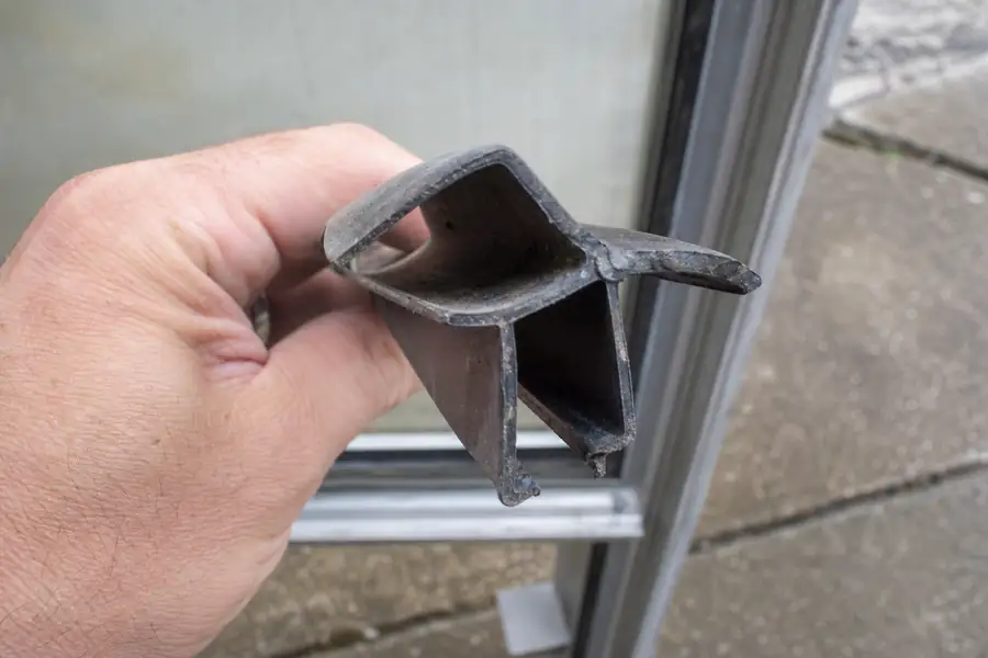 Old discontinued reach-in cooler gasket profile held up for comparison before fabrication